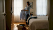 Woman sorting closet during fashion upgrade