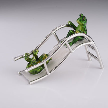 Two Frogs Riding Slide
