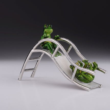 Two Frogs Riding Slide